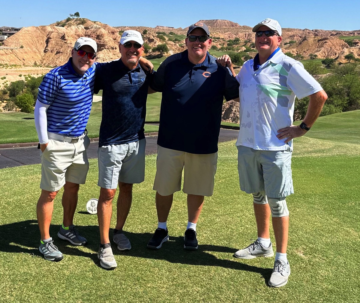 Four-man scramble to break 100